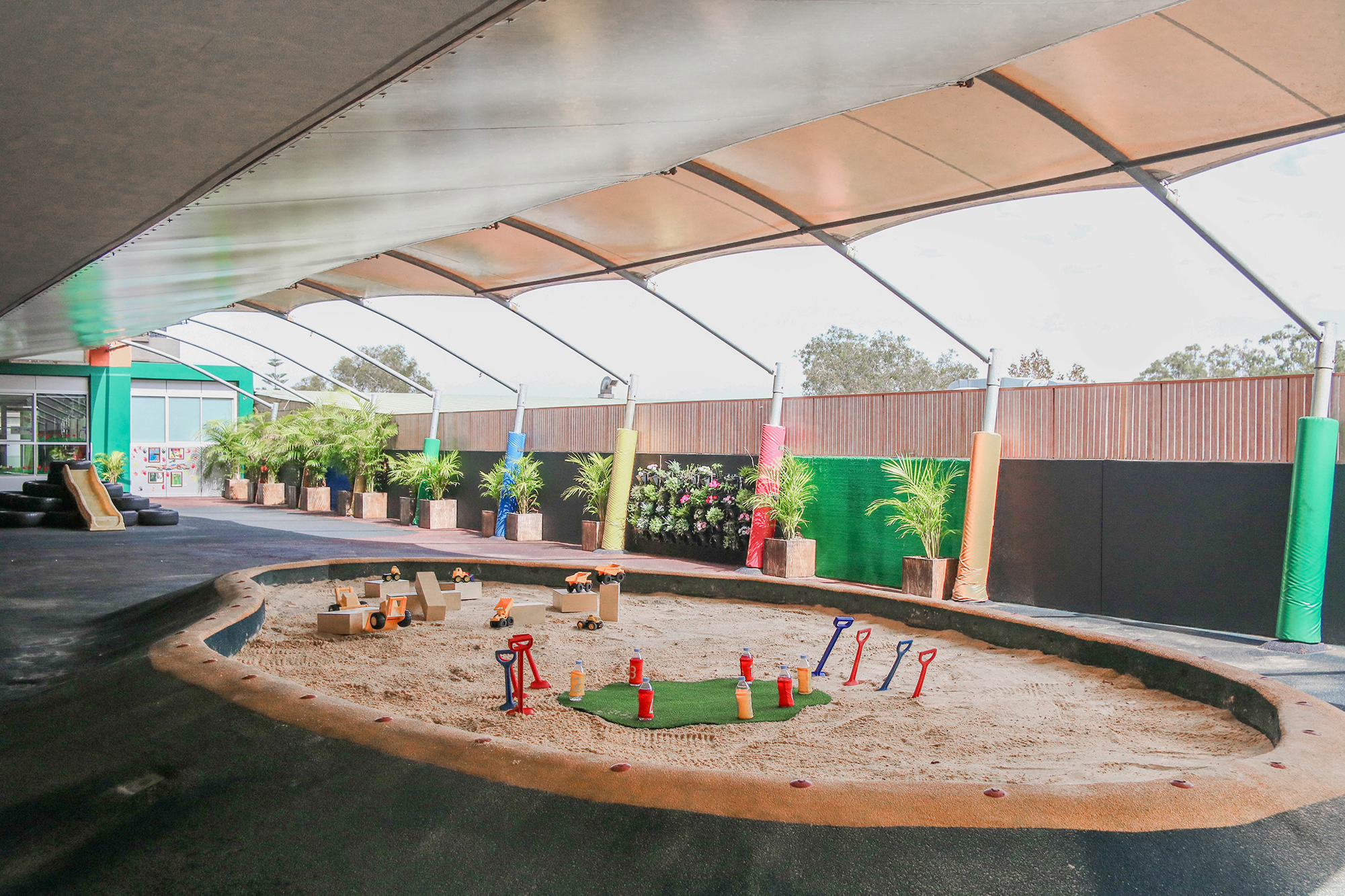 Large covered all weather playground and sandpit at our Maroubra childcare centre